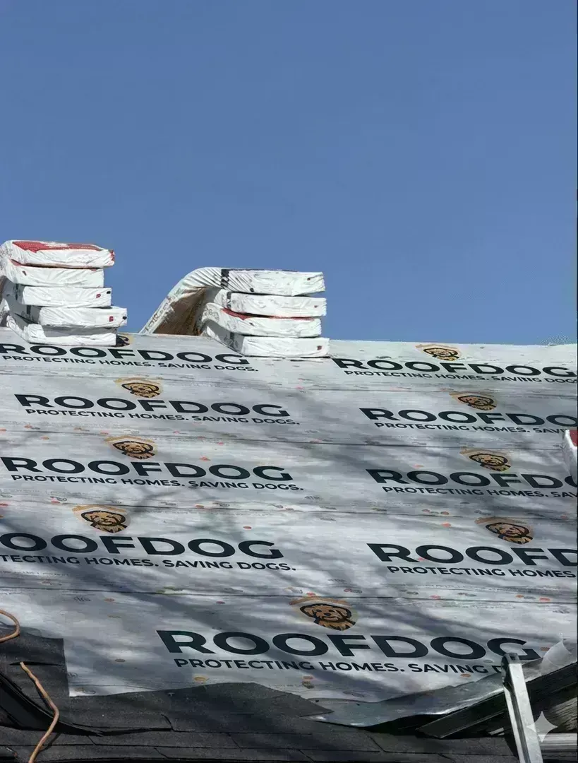 Damaged roof with curling shingles on a Dallas Fort Worth home showing signs of needed replacement