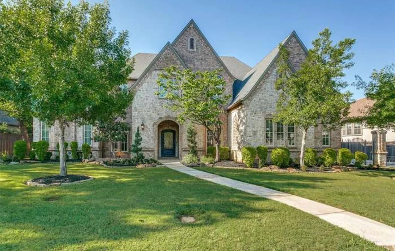 Luxury estate home with completed Class 4 impact-resistant shingle roof replacement on Kimball Hill Ct in the Kimball Hills subdivision of Southlake, TX 76092 — RoofDog residential roofing project