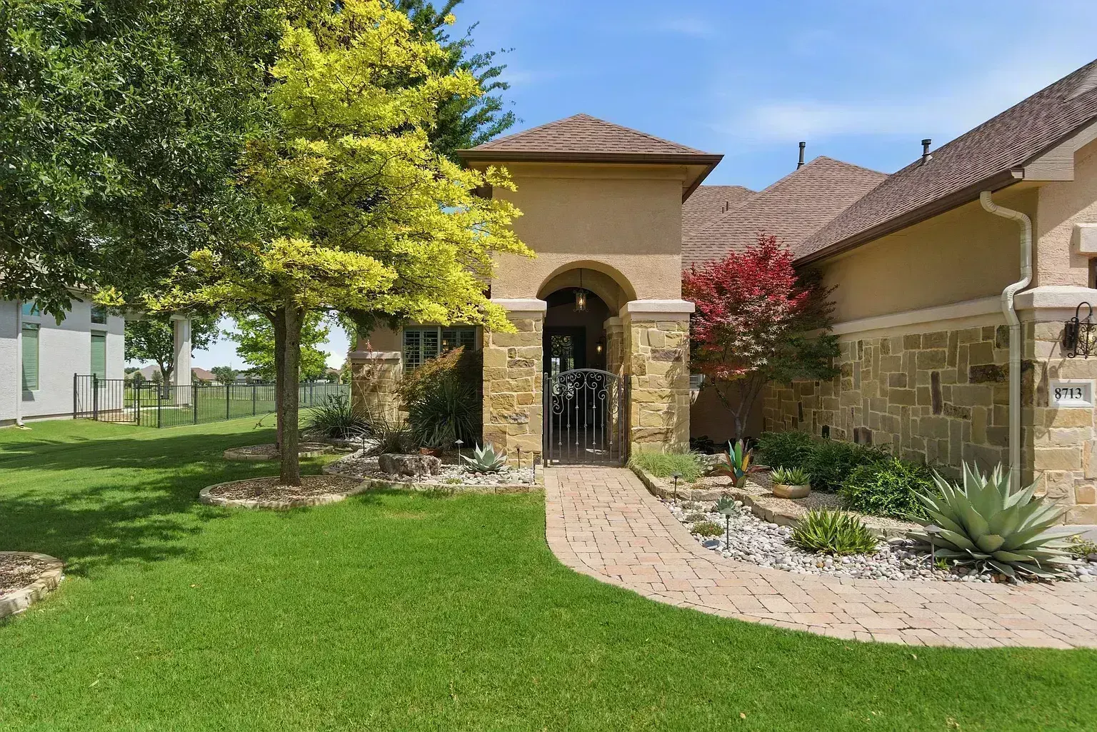 Full roof replacement on Gardenia Drive in Denton, TX 76207 — stone and stucco estate home with Class 4 architectural shingles by RoofDog